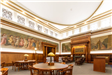 Library Mural Room Seating Area with Tables and Fireplace Area
